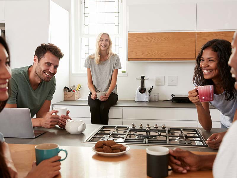Friends Laughing in Kitchen